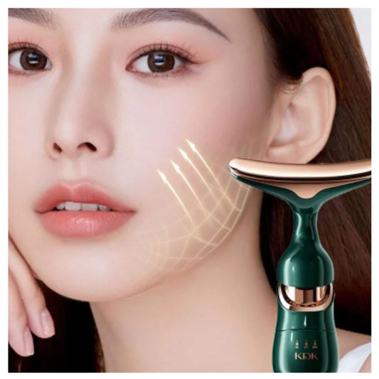 Close-up of woman using green and rose gold 3 in 1 anti wrinkle face neck eye massager device on cheek with glowing grid graphic for skin treatment - KIK brand