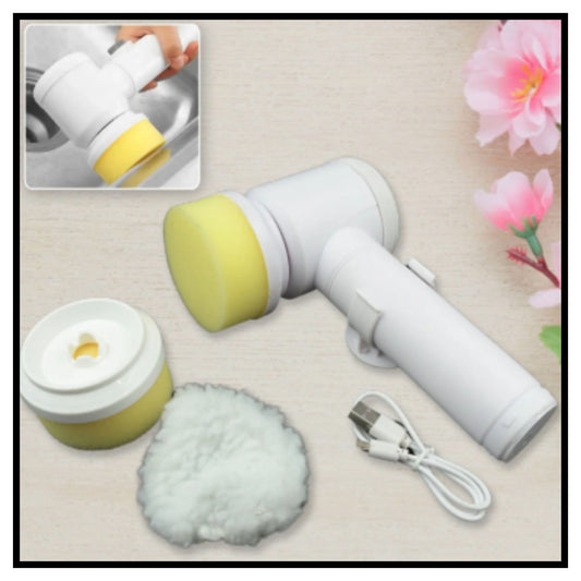 White electric handheld cleaning brush with yellow foam head shown with USB charging cable small brush attachment and fluffy white cleaning pad on beige background with pink flowers