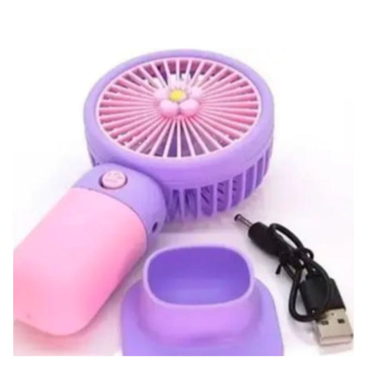 🌀 Mini Handheld Fan – Small Pastel Pink and Lavender Purple Portable Fan with Flower Center, USB Charging Cable and Matching Purple Stand on White Background