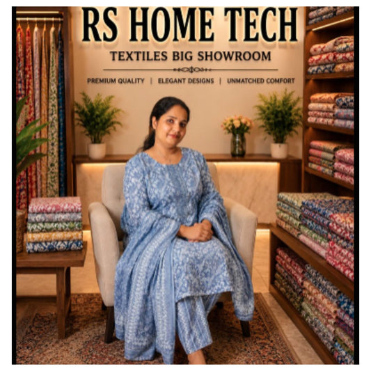 Woman Wearing Light Blue Printed Churidar Set Sitting In RS Home Tech Textiles Showroom