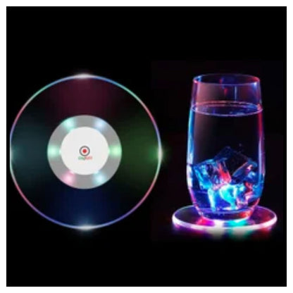 ✨ LED Wine Glass – Clear Stemmed Wine Glass Filled with Water with Bright Green Illuminated Ring Light at Base Casting Glow on White Surface