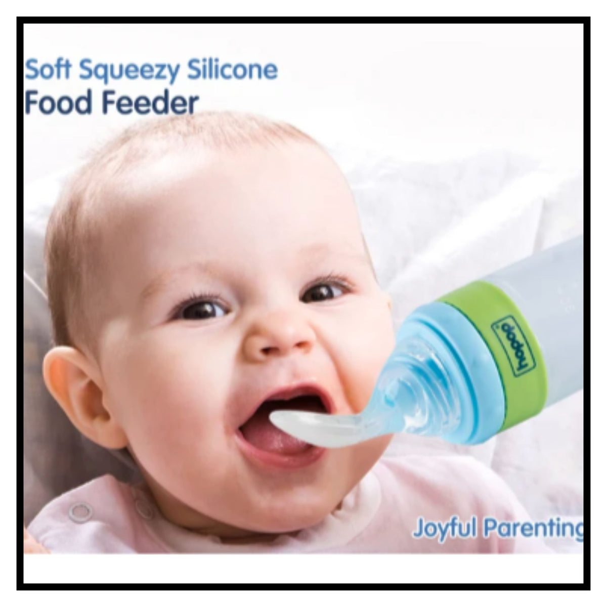 Happy baby being fed with blue soft squeezable silicone food feeder bottle with green cap labeled Soft Squeezy Silicone Food Feeder