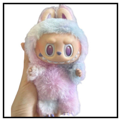 Labubu The Monsters Tasty Macarons Chestnut Cocoa vinyl plush toy in pastel fuzzy outfit with bunny ears held in hand