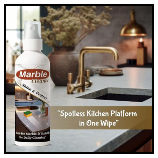 A bottle of Marble Cleaner spray shown in front of a kitchen sink and faucet with text reading Spotless Kitchen Platform in One Wipe