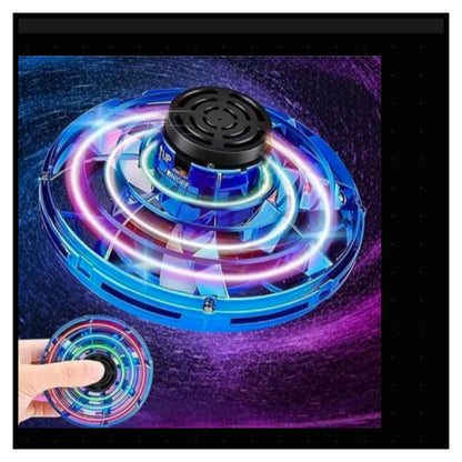 Colorful mini UFO flying spinner toy with glowing LED neon lights blue and pink hovering with hand holding smaller version