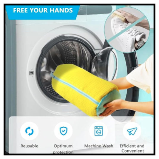 Yellow reusable shoe washing machine mesh bag with zipper being placed into washing machine drum