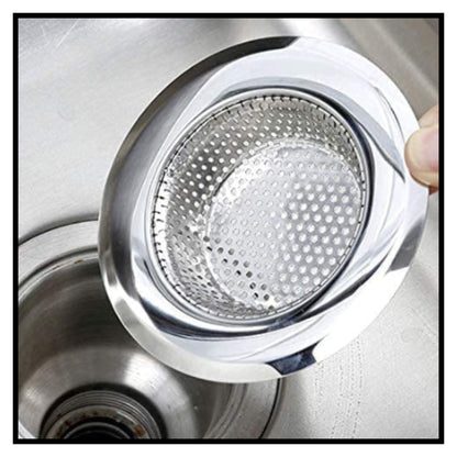 Stainless steel mesh sink strainer held over kitchen sink drain showing perforated filter design