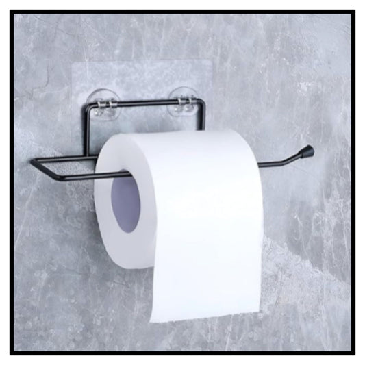 Black metal toilet paper holder with two clear suction cups mounted on gray textured wall holding a roll of white toilet paper